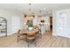 Well-lit dining area adjacent to a modern kitchen, perfect for gatherings at 1104 Desert Candle Dr, Ocoee, FL 34761