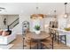 Open-concept living space with a combined dining and kitchen area, ideal for entertaining at 1104 Desert Candle Dr, Ocoee, FL 34761