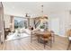 Bright, open-concept living space with wood floors and ample natural light at 1104 Desert Candle Dr, Ocoee, FL 34761