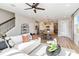 Cozy living room with modern decor, and easy access to kitchen and dining area at 1104 Desert Candle Dr, Ocoee, FL 34761