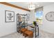 Bright office with modern decor, large window, stylish desk, and unique bookshelf at 1104 Desert Candle Dr, Ocoee, FL 34761