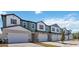 Inviting townhomes with neutral colors, two car garages, and professional landscaping at 2465 Magnolia Reserve Rd, Ocoee, FL 34761