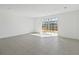 Bright living room area with tile floors and sliding glass doors that provide plenty of natural light at 2465 Magnolia Reserve Rd, Ocoee, FL 34761