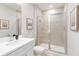 Bright bathroom features a tiled walk-in shower with glass doors and neutral paint at 2473 Magnolia Reserve Rd, Ocoee, FL 34761