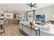 Inviting living room flows seamlessly into a modern kitchen, creating an open and airy living space at 2473 Magnolia Reserve Rd, Ocoee, FL 34761