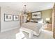 Main bedroom with large window, modern lighting fixture, and contemporary decor at 2473 Magnolia Reserve Rd, Ocoee, FL 34761