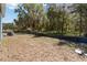 Large backyard with potential for landscaping and outdoor activities, surrounded by natural scenery at 5228 Luisa Ct, St Cloud, FL 34771