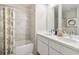Bright bathroom featuring a double vanity, modern fixtures, and a shower-tub combination at 5228 Luisa Ct, St Cloud, FL 34771
