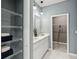 Well-organized bathroom with open shelving for storage and a double sink vanity at 5228 Luisa Ct, St Cloud, FL 34771