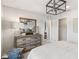 Spacious bedroom featuring a wooden dresser, decorative mirror, and a view into the ensuite bathroom at 5228 Luisa Ct, St Cloud, FL 34771
