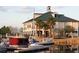 Lovely exterior view of a waterfront building and marina with palm trees and moored boats at 5228 Luisa Ct, St Cloud, FL 34771