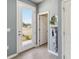Welcoming foyer with wood-look floors and convenient coat storage and light-filled entry at 5228 Luisa Ct, St Cloud, FL 34771
