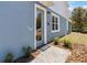 Inviting front entrance with a decorative doormat and manicured landscaping at 5228 Luisa Ct, St Cloud, FL 34771