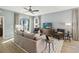 This spacious living room has lots of natural light and a ceiling fan at 5228 Luisa Ct, St Cloud, FL 34771