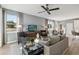 This spacious living room has lots of natural light and a ceiling fan at 5228 Luisa Ct, St Cloud, FL 34771