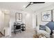 Cozy loft area with a comfortable chair, workspace, and natural light at 5228 Luisa Ct, St Cloud, FL 34771
