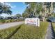 Charming Crabby's on the Lakefront restaurant sign surrounded by vibrant greenery at 5228 Luisa Ct, St Cloud, FL 34771