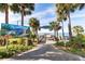 A scenic boardwalk that leads to Melbourne Beach pier, framed by lush landscaping and palm trees at 5289 Luisa Ct, St Cloud, FL 34771
