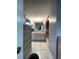 Bright bathroom with white cabinets and tiled floors, accessible from the main bedroom at 10867 Sw 83Rd Ct, Ocala, FL 34481