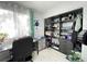 Bedroom featuring a closet with organizational shelves and drawers at 10867 Sw 83Rd Ct, Ocala, FL 34481