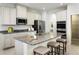 Spacious kitchen with granite countertops, stainless steel appliances, and a large island with seating at 5012 Bear Lake Loop, Deland, FL 32724