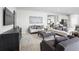 Elegant living room with contemporary decor, plush seating, and stylish accents at 11026 Nellie Crossing Cir, Clermont, FL 34711