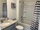 Bathroom featuring granite countertop vanity and shower with tub combination at 1707 Jindo Dr, Lake Alfred, FL 33850