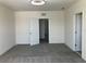 Bright bedroom with two doorways and neutral carpeting at 1707 Jindo Dr, Lake Alfred, FL 33850