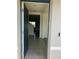 View of the entryway, showing the front door and tile flooring at 1707 Jindo Dr, Lake Alfred, FL 33850