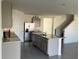 Kitchen with stainless steel appliances, granite countertops, and gray cabinets at 1707 Jindo Dr, Lake Alfred, FL 33850