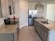Modern kitchen featuring stainless steel appliances and granite countertops at 1707 Jindo Dr, Lake Alfred, FL 33850