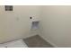 Tiled laundry room with utility connections at 1707 Jindo Dr, Lake Alfred, FL 33850