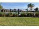 Scenic view of community pool area with palm trees and lush green plants at 1707 Jindo Dr, Lake Alfred, FL 33850