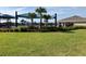 Community pool area with water features and shaded picnic area at 1707 Jindo Dr, Lake Alfred, FL 33850