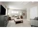 Relaxing bonus room featuring neutral tones, comfortable seating, a TV, and natural light creates a peaceful retreat at 2088 Aibonito Cir, Clermont, FL 34711