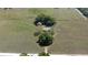 Aerial view of the vast land, home, pool, and barn; a perfect blend of space and nature at 3815 Se 25Th St, Bushnell, FL 33513