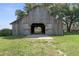 View of the barn featuring the open entrance with a concrete base and lots of land at 3815 Se 25Th St, Bushnell, FL 33513
