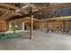 Large barn interior featuring sturdy wooden beams and open layout, suitable for various uses at 3815 Se 25Th St, Bushnell, FL 33513