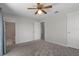 Spacious bedroom with a ceiling fan, neutral colors, and access to the bathroom and closet at 3815 Se 25Th St, Bushnell, FL 33513