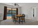 Elegant dining area with sliding glass doors to the pool area, creating a seamless indoor-outdoor flow at 3815 Se 25Th St, Bushnell, FL 33513