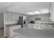 Modern kitchen with stainless steel appliances, sleek gray countertops, and plenty of cabinet space at 3815 Se 25Th St, Bushnell, FL 33513