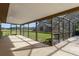 Screened patio overlooking a pasture and barn, perfect for enjoying the outdoors at 3815 Se 25Th St, Bushnell, FL 33513