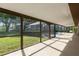 Relax on this covered, screened patio with views of the fenced yard and sparkling pool at 3815 Se 25Th St, Bushnell, FL 33513