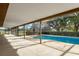 Enjoy the outdoors from this screened in patio overlooking a pool and barn in the backyard at 3815 Se 25Th St, Bushnell, FL 33513
