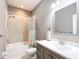 Well-lit bathroom featuring a shower-tub combination, updated vanity, and a modern sink at 4649 Sw 103Rd Street Rd, Ocala, FL 34476