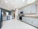 Spacious kitchen features stainless steel appliances, granite countertops, and ample cabinet space at 4649 Sw 103Rd Street Rd, Ocala, FL 34476