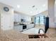 Open kitchen with granite countertops, stainless steel appliances, and a breakfast bar area at 4649 Sw 103Rd Street Rd, Ocala, FL 34476
