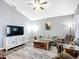 Comfortable living room features a plush sofa, recliner, and modern decor at 4649 Sw 103Rd Street Rd, Ocala, FL 34476