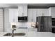 Bright and modern kitchen featuring stainless steel appliances and white cabinetry at 11018 Nellie Crossing Cir, Clermont, FL 34711