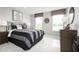 Well-lit bedroom with a comfortable bed, stylish decor, and large windows that offer plenty of natural light at 11054 Nellie Crossing Cir, Clermont, FL 34711
